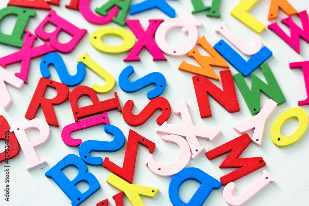Multicolored wooden letters of the English alphabet on a white background, education and business online, Flat Lay abc. High quality photo Multicolored wooden letters of the English alphabet on a white background, education and business online, Flat Lay abc. High quality photo