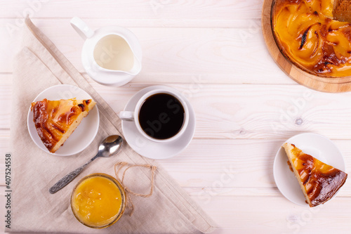 traditional homemade baked cake or tart and espresso in a cup