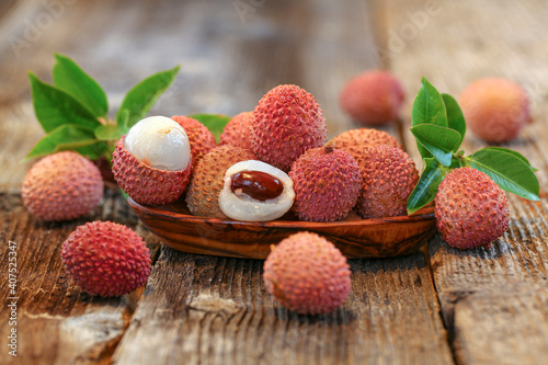 litchi, lichee, lychee, or lichi, Litchi chinensis on old rustic wood background