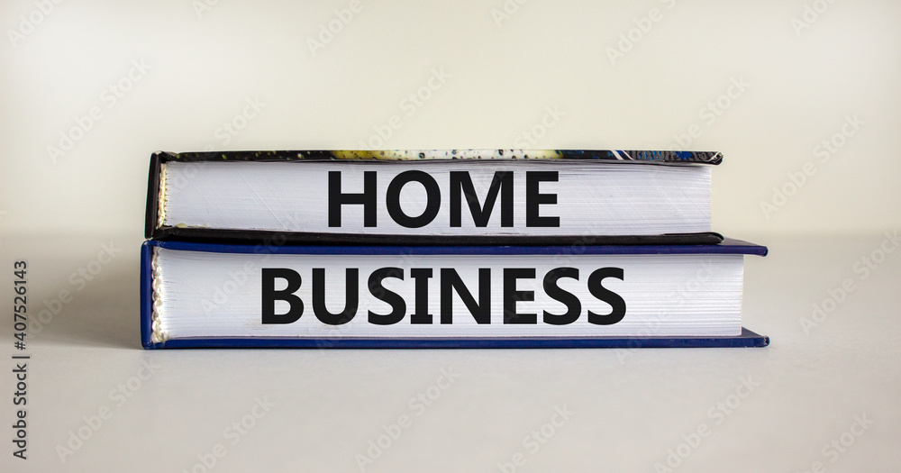 Home business symbol. Books with words 'home business' on beautiful white table. White background. Business and home business concept. Copy space.