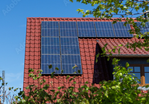 solar panels on a red tiled roof