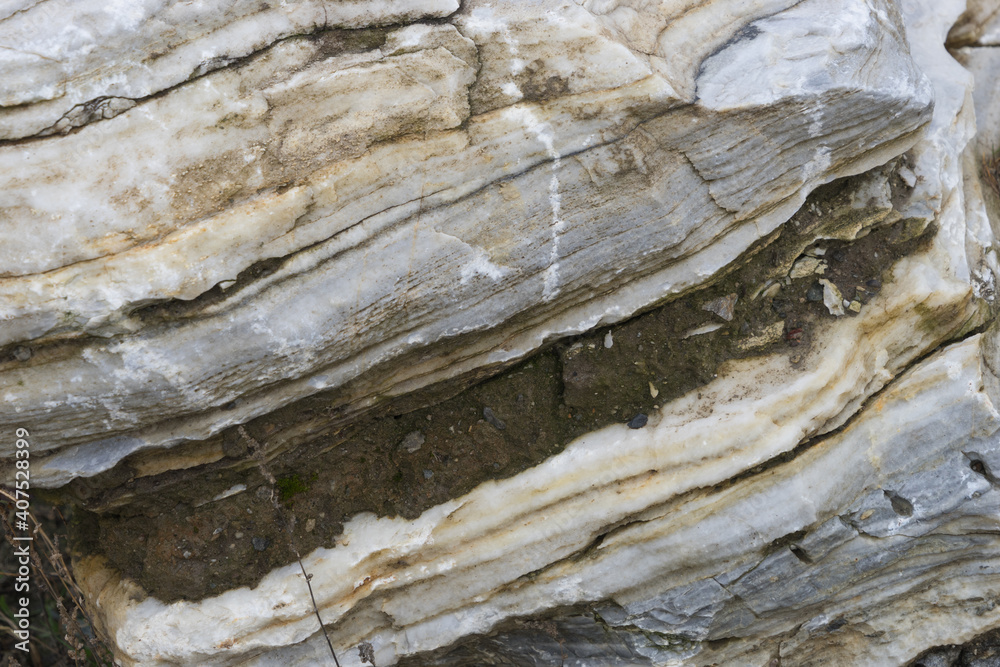Old natural stone texture with multicolored layers
