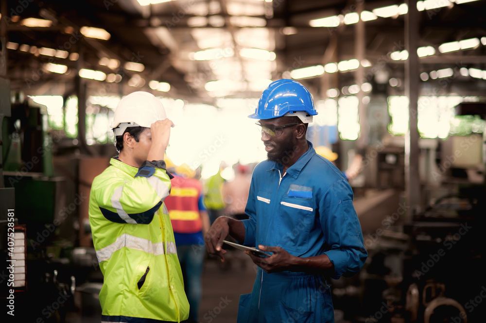 Group of industrial worker team and foreman consist of Technicians, Engineers is discussing and working with many equipment and machine in Industry plant. Group of industrial worker team and foreman consist of Technicians, Engineers is discussing and working with many equipment and machine in Industry plant.