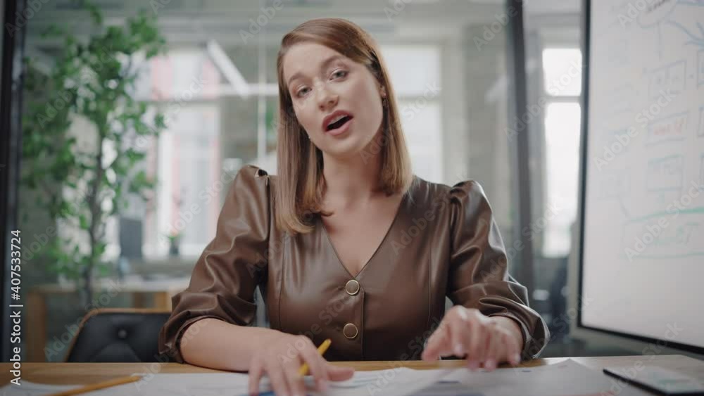 Point of View from Camera with Beautiful Young Project Manager Making a Video Call in Creative Office Environment. Happy Caucasian Female Specialist Talking to Colleague Over a Live Camera.