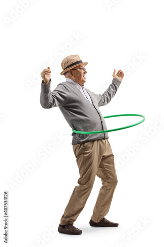 Full length shot of an elderly gentleman spinning a hula hoop