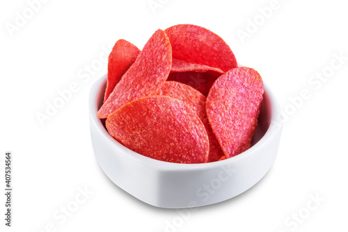 Red potato chips with salt on a white isolated background
