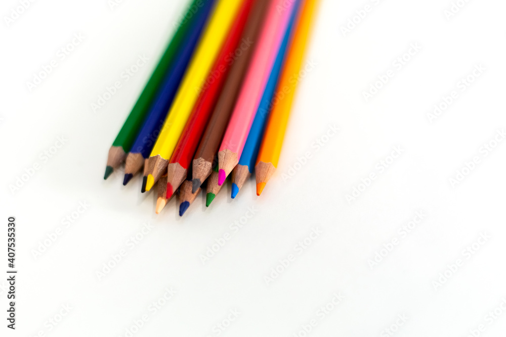 Close Up colored wooden pencils. Isolated on white background.