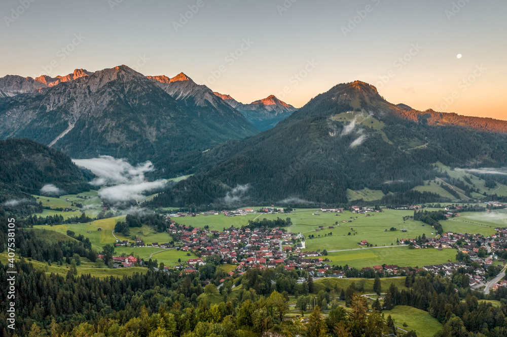 Obraz premium Aerial view of German Village Bad Oberdorf at sunrise near Zugspitze and austria border