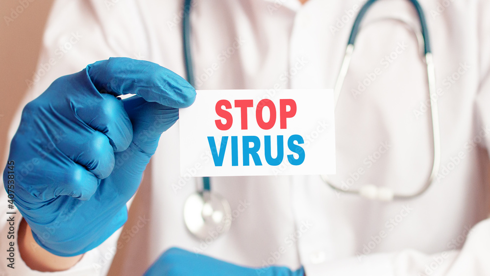 stop virus card in hands of Medical Doctor stop virus card in hands of Medical Doctor