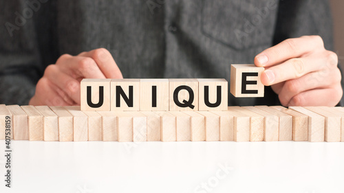 Tableau sur toile the word of UNIQUE on building blocks concept