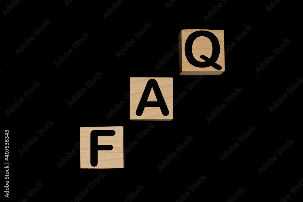 Wooden blocks with word FAQ on black baclground. Frequently asked question concept Wooden blocks with word FAQ on black baclground. Frequently asked question concept