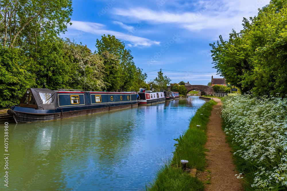 A view of narrow boats moored in the canal basin on the Oxford Canal at the village of Napton, Warwickshire in summertime