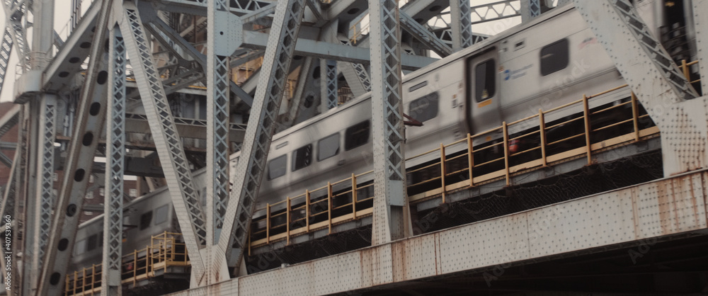 train passing by in a bridge in new york train passing by in a bridge in new york