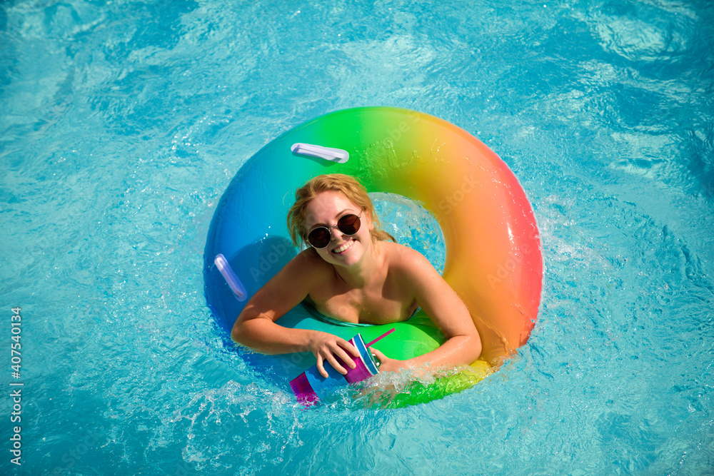 Summer happy woman in pool. Summertime girl in sunglasses. Summer leisure and holiday,