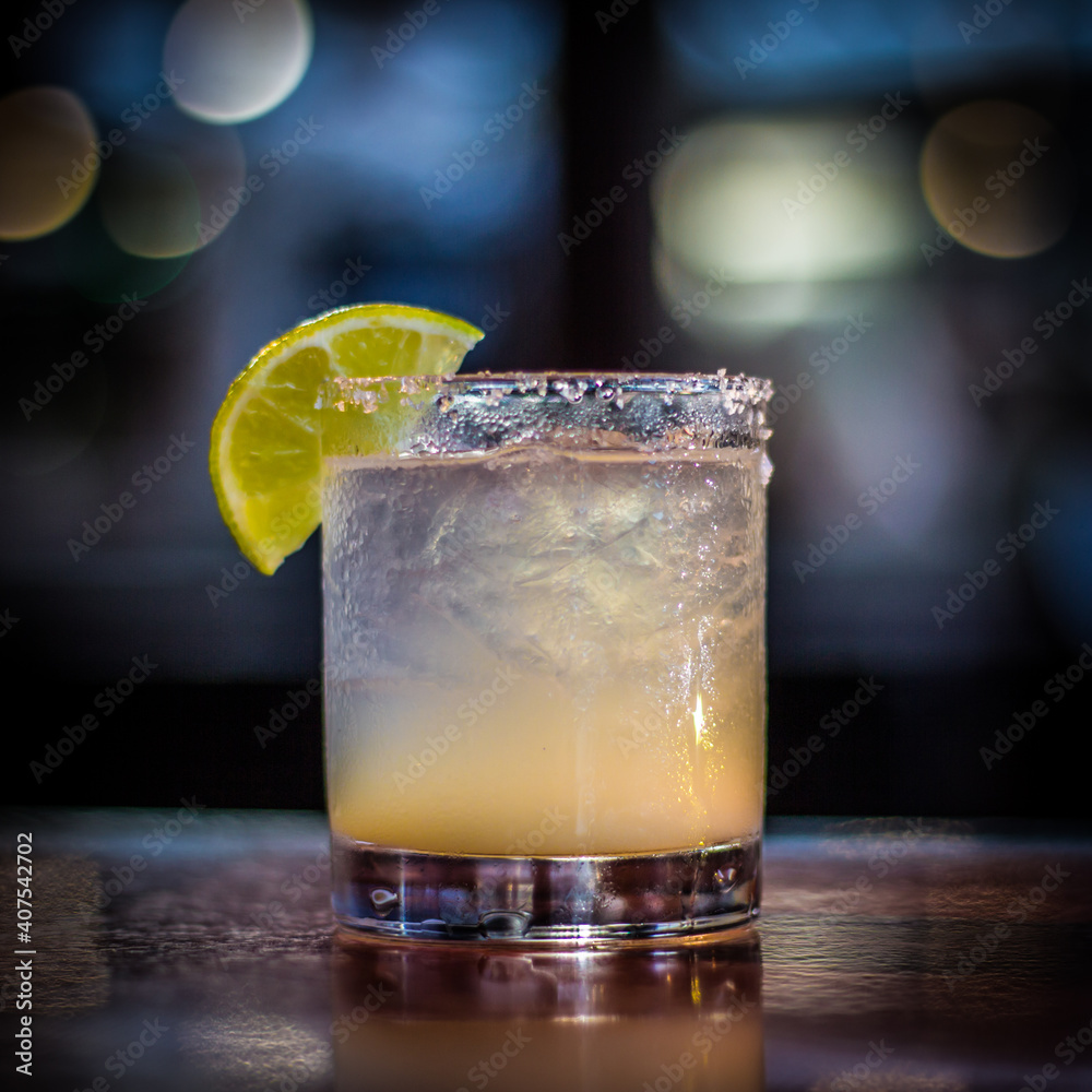 Margarita cocktail drink beverage with lemon slice and bokeh background Margarita cocktail drink beverage with lemon slice and bokeh background
