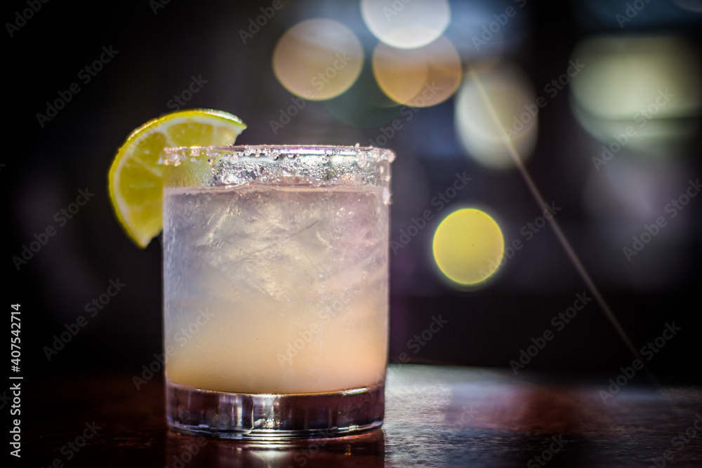 Margarita cocktail drink beverage with lemon slice and bokeh background Margarita cocktail drink beverage with lemon slice and bokeh background