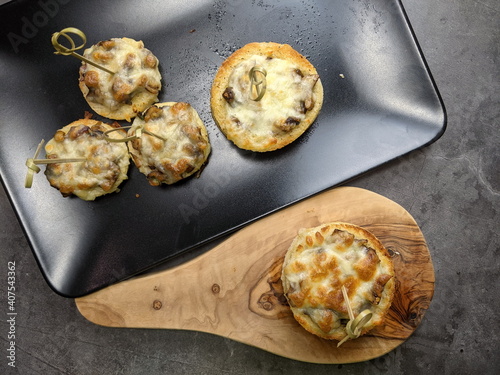 A platter of Cheesy Mushroom croustades or Cheesy Mushroom Discs photo