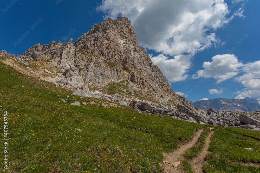 Path at the foots of the southern slope of Mount Small Settsass, Dolomites, Italy