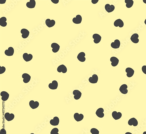 Endless seamless pattern of hearts of different directions. Black vector hearts on yellow. Wallpaper for wrapping paper. Background for Valentine's Day