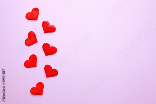 Red confetti over pink background with copy space for Valentine's Day