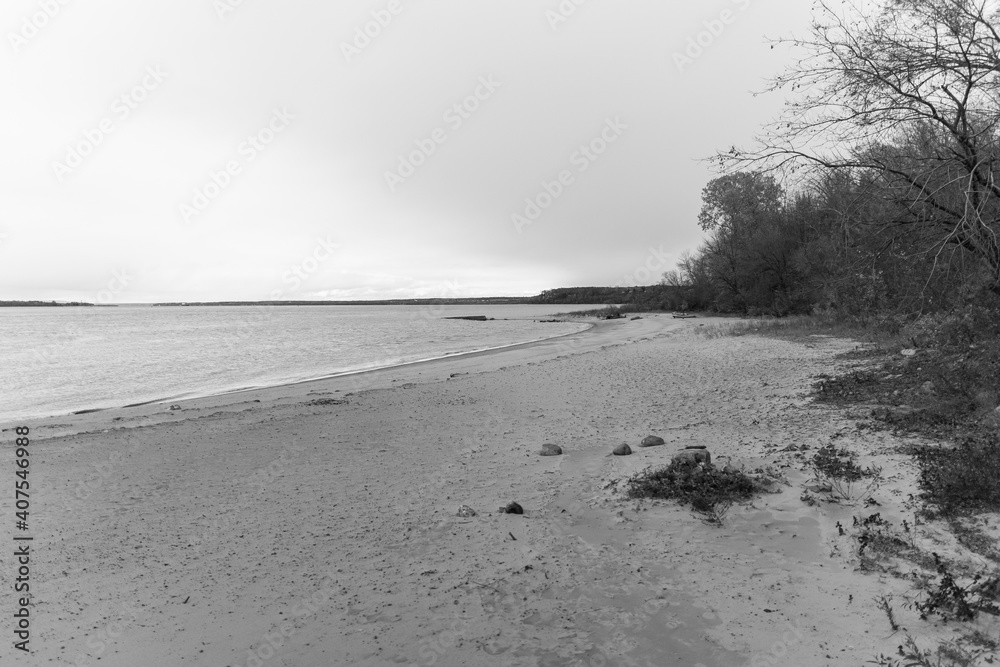 Beautiful seascape in black and white. Mesmerizing shore or beach with a melancholic atmosphere.