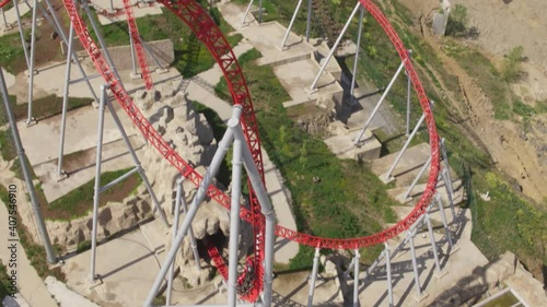 Rollercoaster and people having fun. Aerial reel frame video.