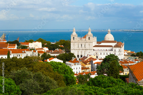 Lisbon, Portugal. Beautiful cityscape of the portuguese capital, Tage river in the backdrop. Church of Santa Engrácia (now the National Pantheon) and Monastery of São Vicente de Fora.