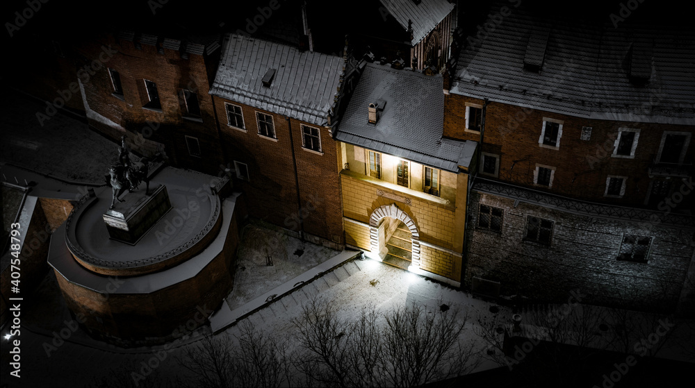 Snow-covered the oldest of the three entrance gates leading to the Wawel Hill in Krakow during winter, Poland.