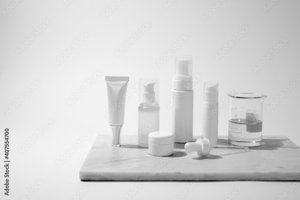 cosmetic and skin care for beauty routine on white background with shadow. modern and minimal product design with essential oil, pestle and mortar. cosmetic and skin care for beauty routine on white background with shadow. modern and minimal product design with essential oil, pestle and mortar.