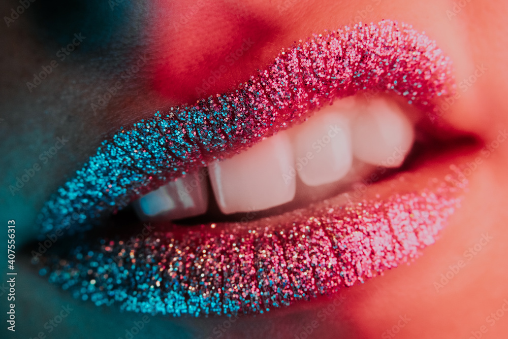 Close-up of displeased angry mouth gesture. Fashion woman grimacing with glowing metallic sparkles lipstick. Macro view of glamorous make-up.  - obrazy, fototapety, plakaty 