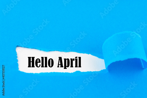 Hello April concept. Inscription in torn envelope