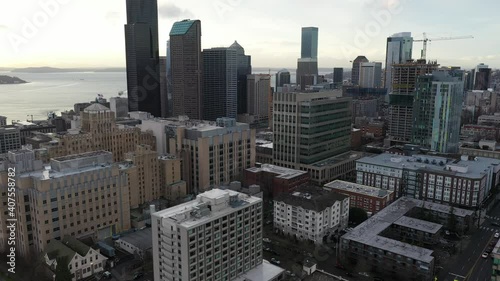 Cinematic aerial drone dolly zoom in clip of First Hill, Yesler Terrace, Atlantic, Cherry Hill, Squire Park, skyscrapers and high-rise commercial and residential buildings downtown Seattle, Washington photo