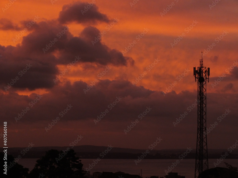 Fototapeta premium sunset over the city and texture clouds