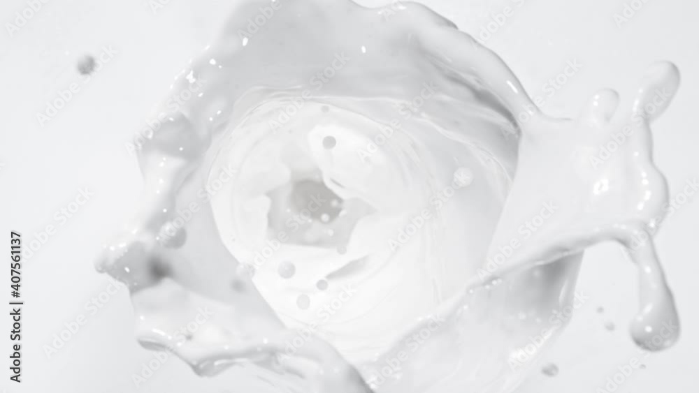 Super slow motion of splashing milk stream, twister shape, macro shot. Filmed on high speed cinema camera, 1000fps. Super slow motion of splashing milk stream, twister shape, macro shot. Filmed on high speed cinema camera, 1000fps.