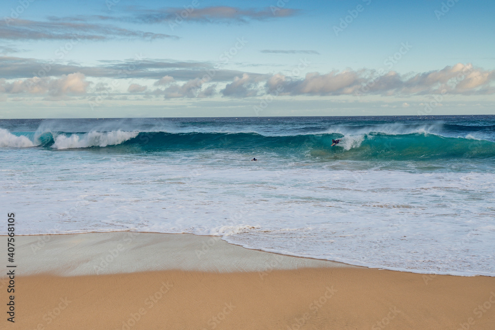 Fototapeta premium waves on the beach surfers