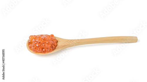 Wooden spoon filled with red caviar isolated on a white background.