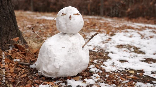 Little snowman in snowy park