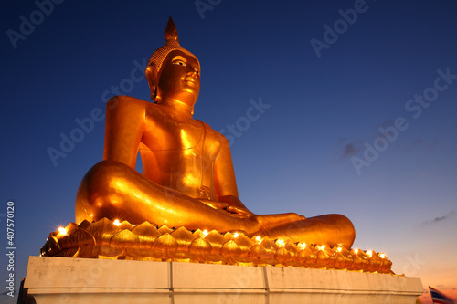  Golden buddha statue in during the night  Thailand