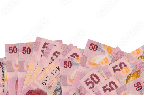 50 Mexican pesos bills lies on bottom side of screen isolated on white background with copy space. Background banner template photo