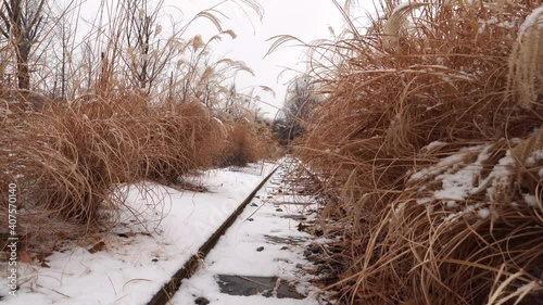 Snow fell on rusty railroad tracks in Seoul Children's Grand Park, South Korea