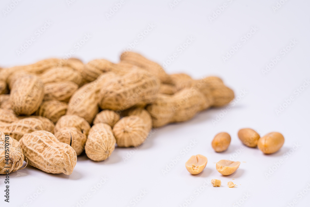 Peanuts with shells on white background Peanuts with shells on white background