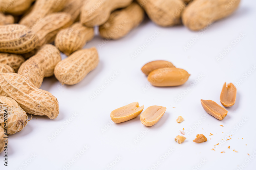 Peanuts with shells on white background Peanuts with shells on white background