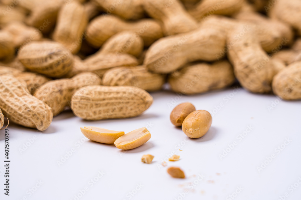 Peanuts with shells on white background Peanuts with shells on white background