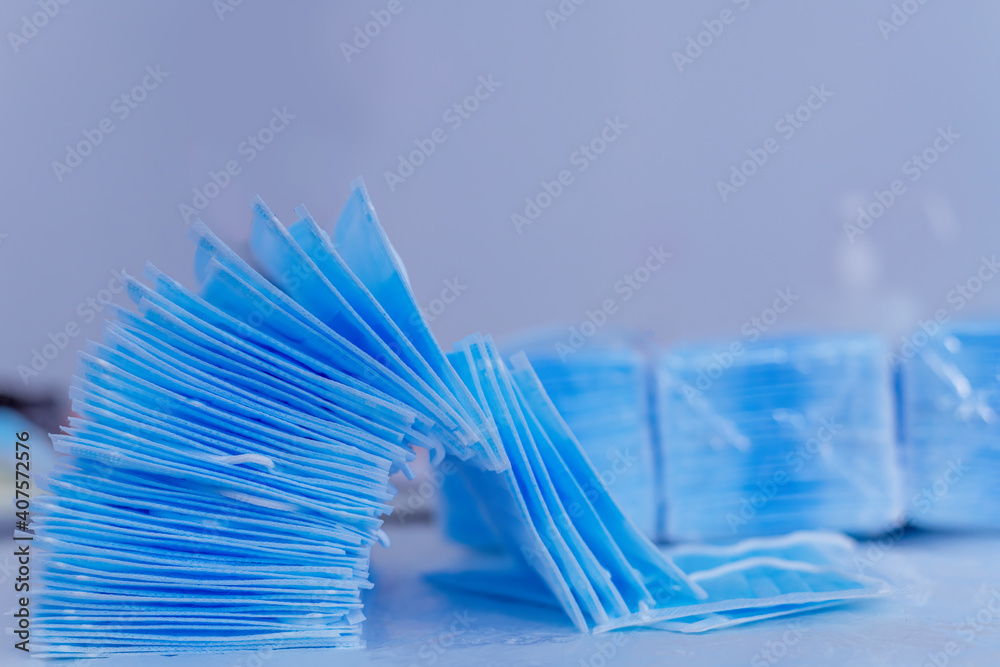 Face surgical masks produce are under packing to distribution customer and hospital to protect form coronavirus or pollution is healthy business concept. Face surgical masks produce are under packing to distribution customer and hospital to protect form coronavirus or pollution is healthy business concept.