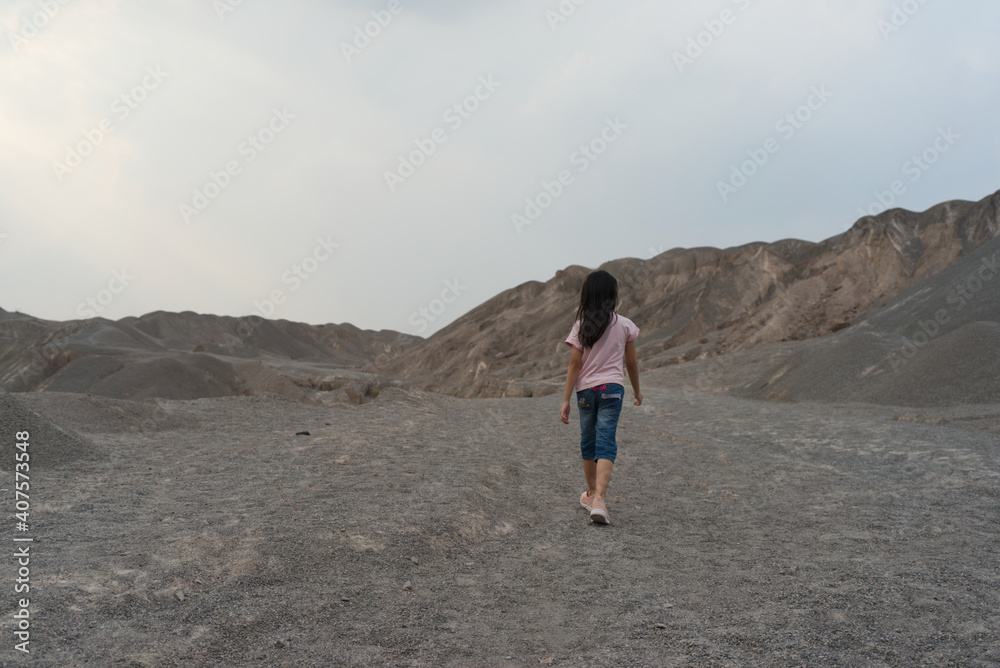 Asian cute child girl 7 years old Walking mountain view