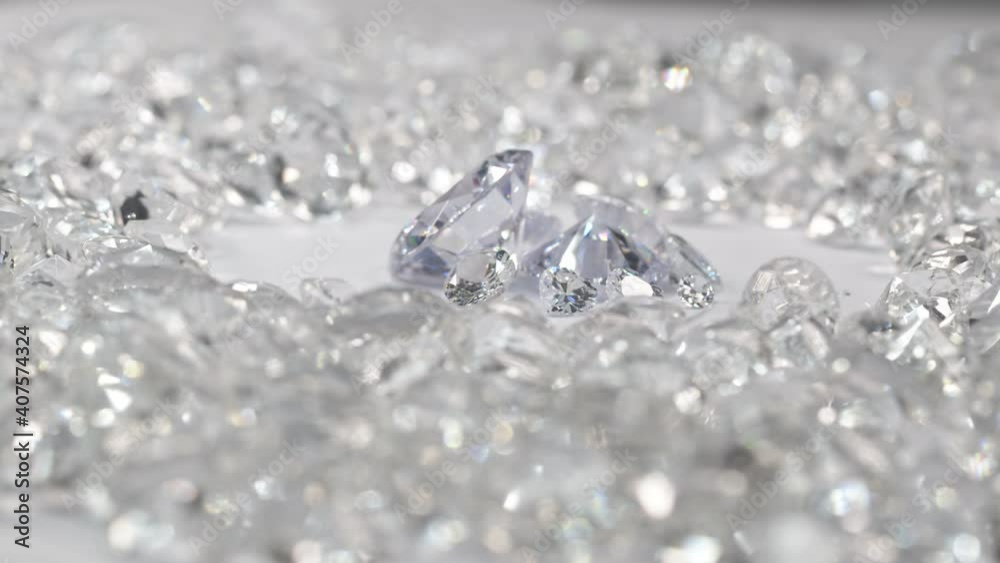 White diamonds of various sizes are placed in a center circle on a white background surrounded by white diamonds..