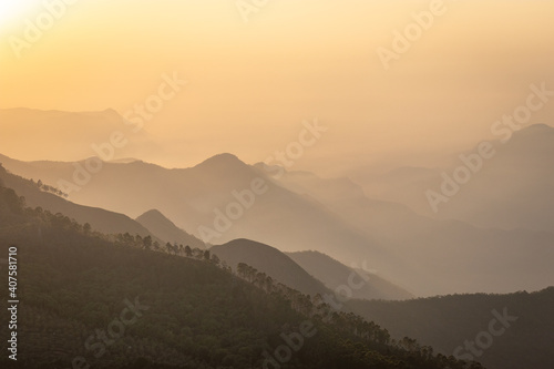 mountain range sunrise at dawn with mist from flat angle