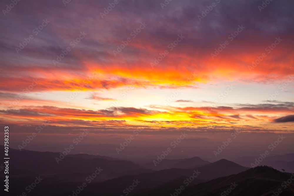 colorful clouds in sunrise over mountain