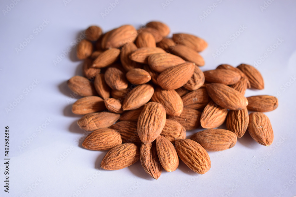 Top View of Closeup Organic Almond Nuts in Group On isolated White Background Top View of Closeup Organic Almond Nuts in Group On isolated White Background