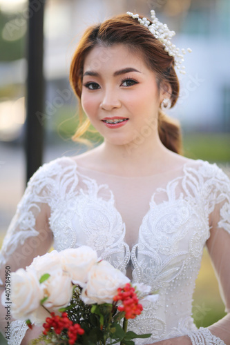 Portrairt of women in white wedding dress at outdoor. photo